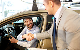 Sales person shaking hand with customer