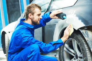 Man waxing car